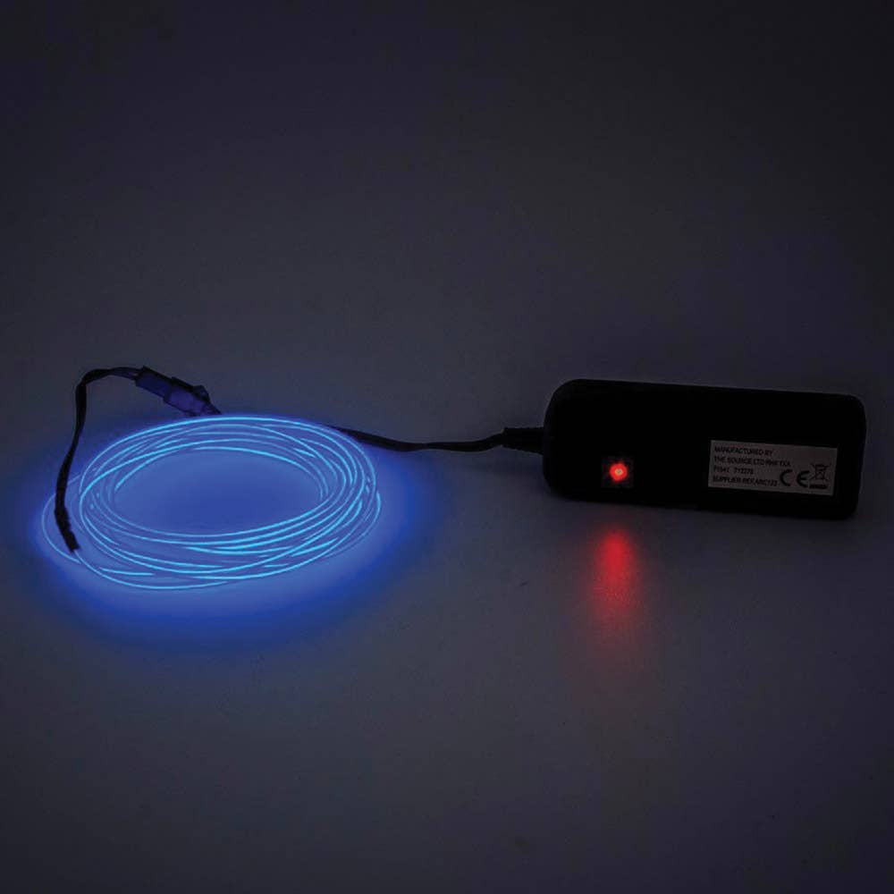 Blue LED strip light with power adapter on a dark background