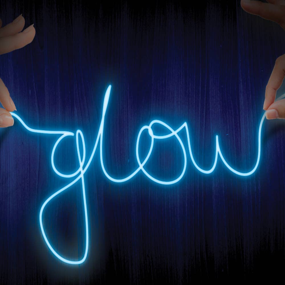 Neon sign spelling 'glow' held by hands against a dark background